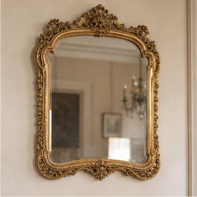Ornate gilded mirror styled in a classic interior